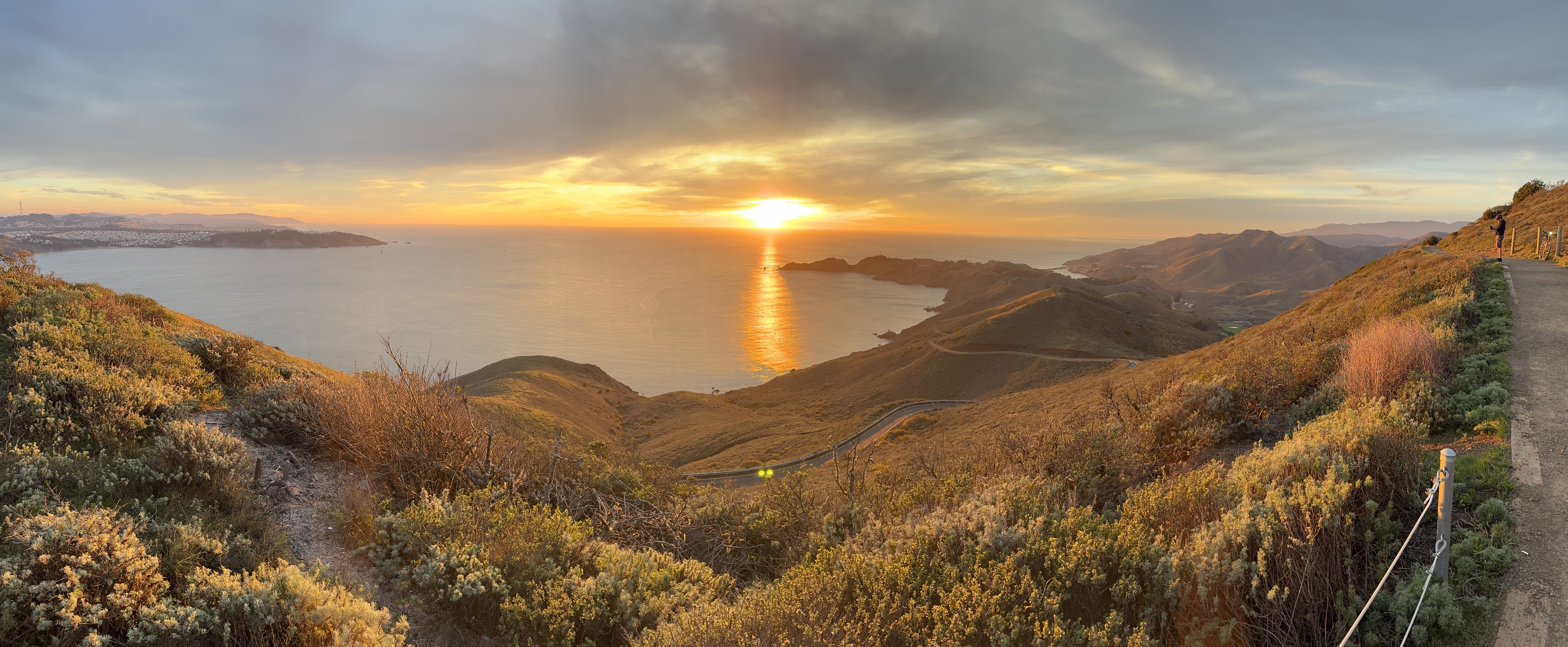 Panoramic sunset view from the Marin Headlands ridgeline looking toward the bay